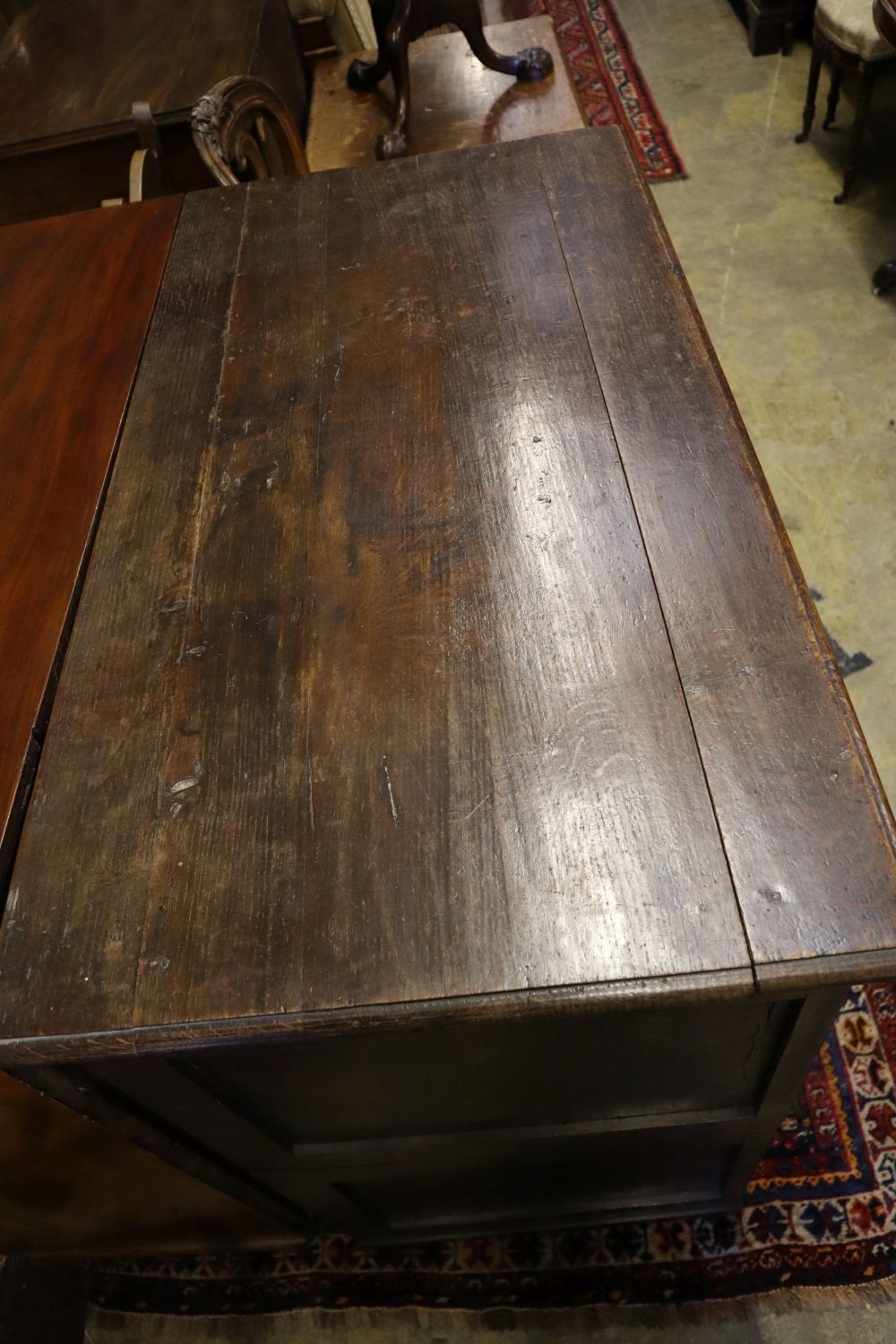 A late 17th century oak chest fitted four geometrically-moulded drawers on block feet, width 108cm depth 56cm height 104cm